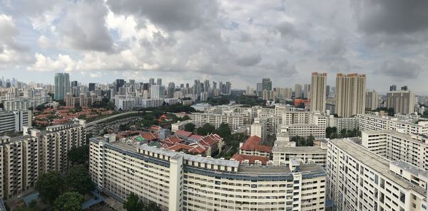 High angle view of modern buildings in city against sky