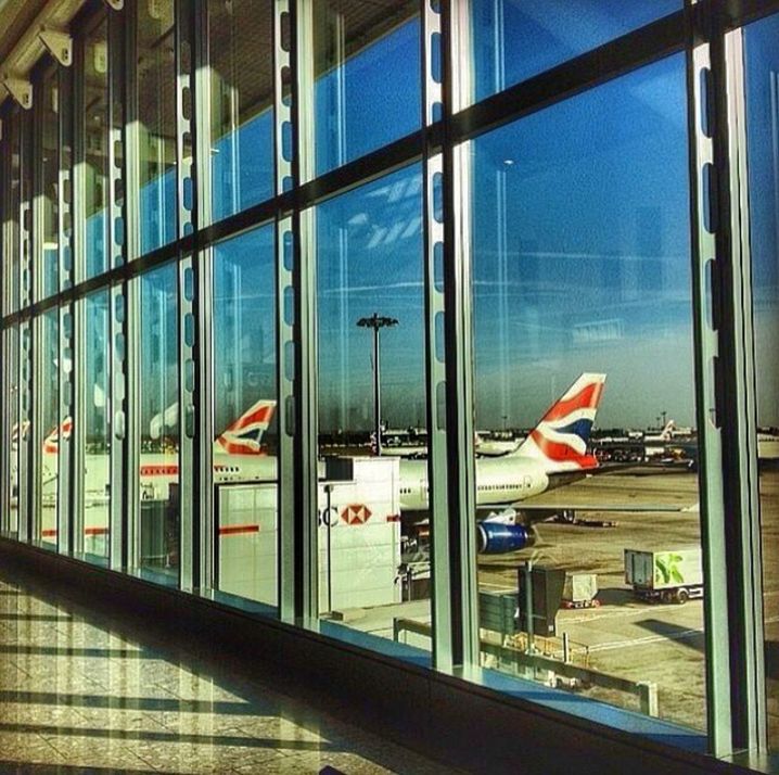 glass - material, window, transparent, architecture, reflection, built structure, indoors, modern, transportation, building exterior, city, flag, glass, building, day, multi colored, no people, american flag, patriotism, mode of transport