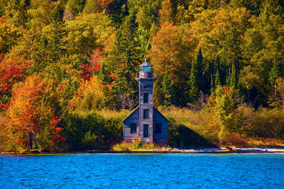 Scenic view of sea against trees