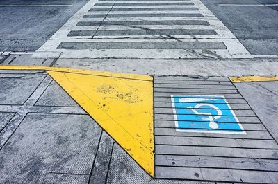 High angle view of disabled sign on street