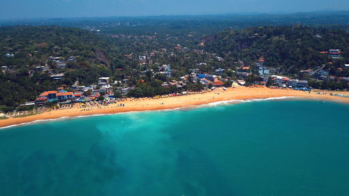 High angle view of sea and cityscape