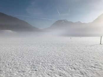 Scenic view of snowcapped mountains against sky