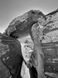 Low angle view of rock formation against sky