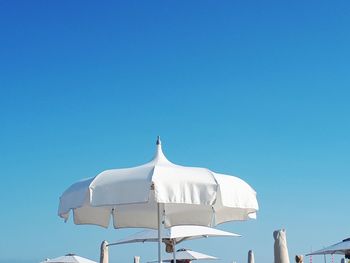 Low angle view of white roof against clear blue sky