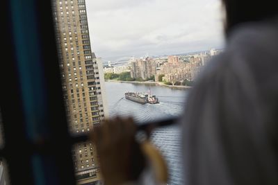 Close-up of cityscape seen through window