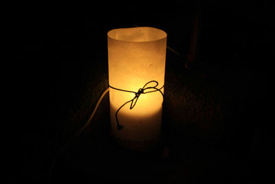 Close-up of illuminated lamp in dark room