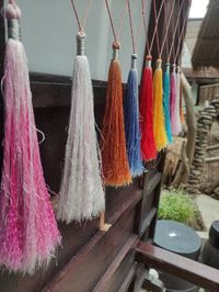 Close-up of multi colored tassel ribbons hanging on display for sale
