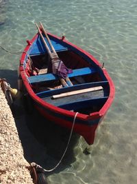 High angle view of boat moored in lake