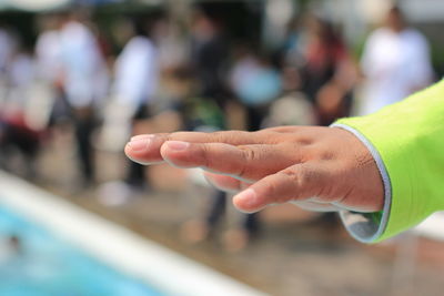 Close-up of child hand outdoors