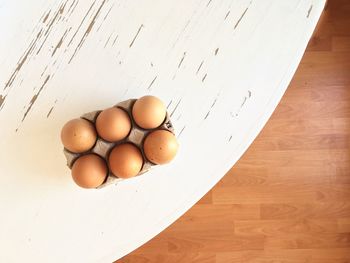 High angle view of eggs in container on table