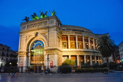 Historical building in city against sky at dusk