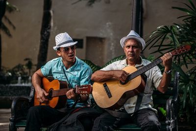 Full length of a man playing guitar