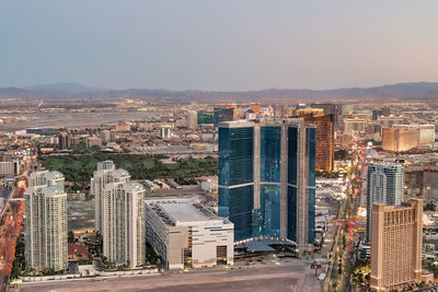 High angle view of buildings in city against clear sky