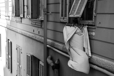 Low angle view of clothes drying outside building