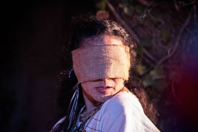 Close-up of woman wearing burlap