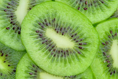 Top view of sliced kiwi fruit texture background, macro shot, close up.