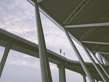 Low angle view of elevated walkway against building