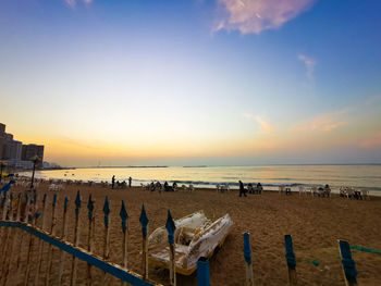 Scenic view of beach against sky during sunset