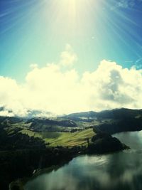 Scenic view of landscape against cloudy sky