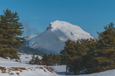 A picturesque landscape view of the french alps mountains on a cold winter day