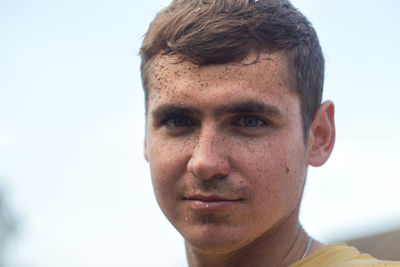 Young dirty worker man on white background. wheat harvest. poverty crisis. working on the 