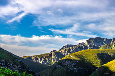 Scenic view of mountains against blue and cloudy sky taken on the garden route in south africa. 