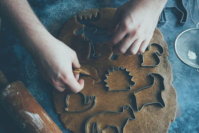 High angle view of man baking on table