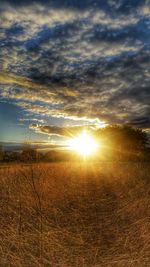 Scenic view of landscape against cloudy sky