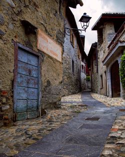 Alley amidst buildings in city