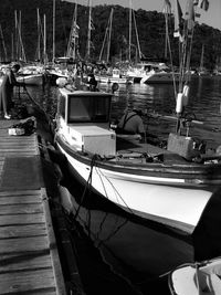 Sailboats moored on shore