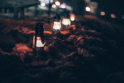 Close-up of illuminated lamp at night