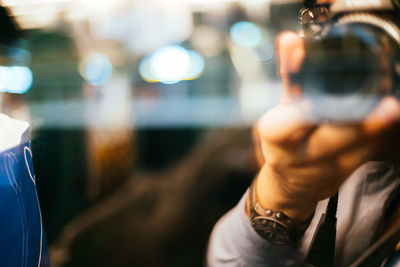 Woman looking at illuminated light