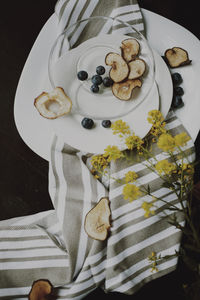 High angle view of fruits in bowls on table