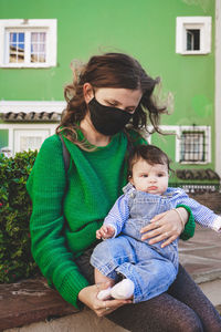 Portrait of mother and daughter outdoors