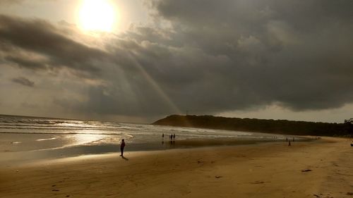 Scenic view of beach against sky during sunset