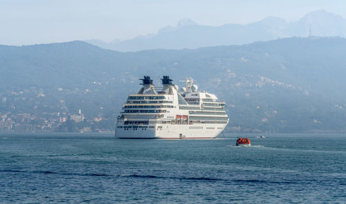 Cruise ship seen in liguria, a region of north-western italy in misty ambiance