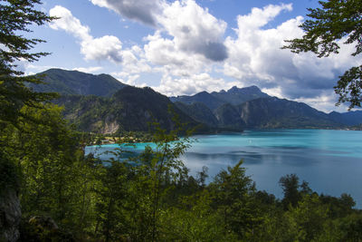 Scenic view of lake and mountains against sky