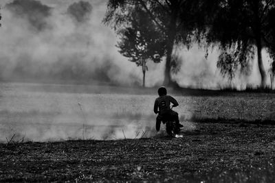 Full length of boy on field