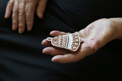 Close-up of hand holding cookie