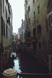 Canal amidst buildings in city