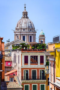 View of buildings in city against clear sky