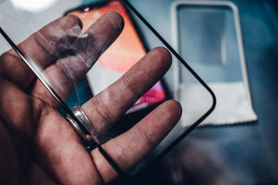 Close-up of hand holding smart phone