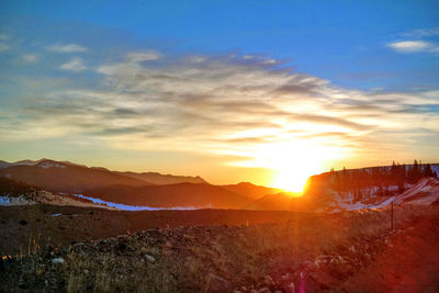 Scenic view of landscape against sky during sunset