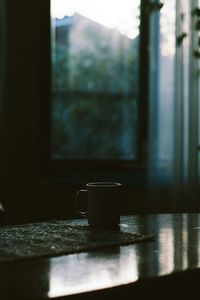 Close-up of water on table by window