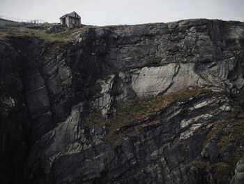 Low angle view of rock formation against sky