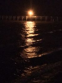 Scenic view of sea against sky at night