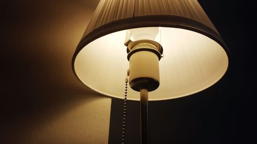 Low angle view of illuminated lamp