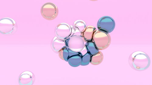 High angle view of pink bubbles on table