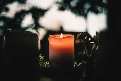 A candle burns atmospherically for the first advent