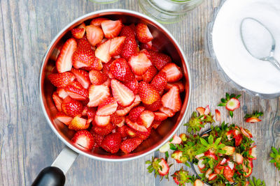 High angle view of strawberries in bowl on table